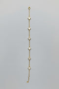Necklace with heart-shaped pendants on a mannequin bust against a neutral background
