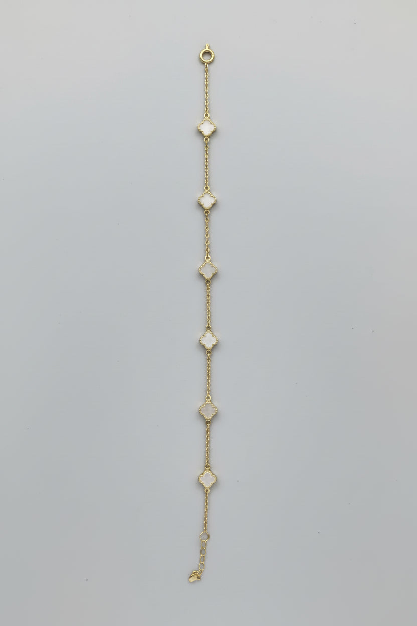 Necklace with heart-shaped pendants on a mannequin bust against a neutral background