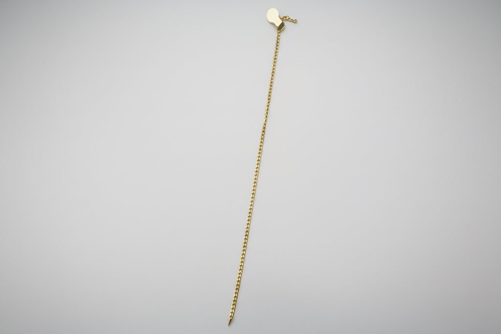 White pants with a gold zipper on a white background